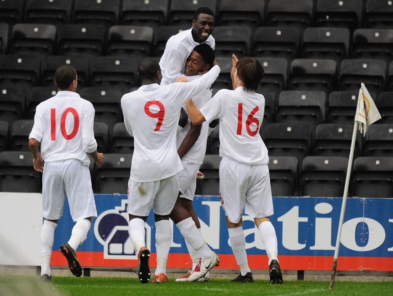 Chuks Aneke is congratulated by Bruno Pilatos and team-mates after scoring the winner against Portugal in The FA International U17 Tournament in 2009.